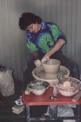 Robert throwing pottery